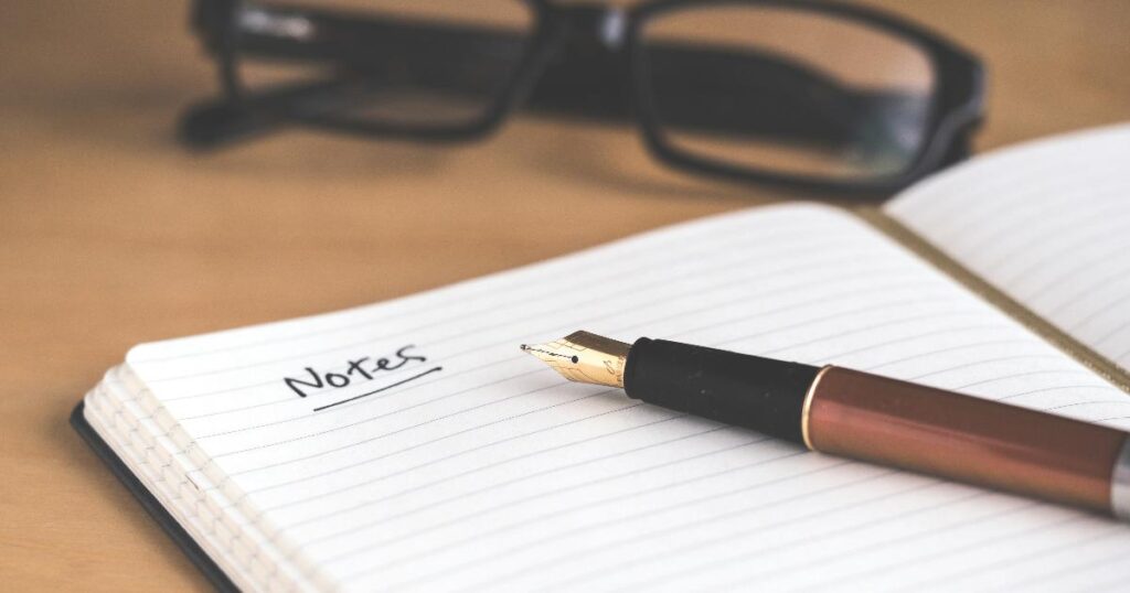 Founder reviewing customer interview notes and market signals as part of a demand validation process