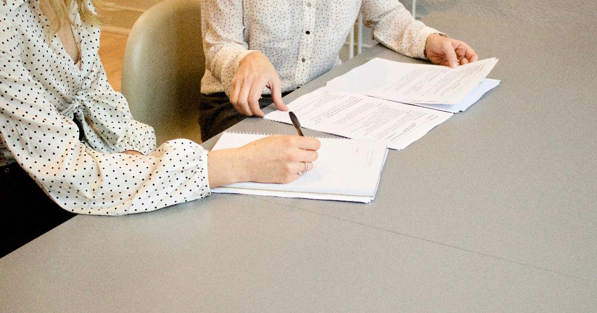 Founder reviewing a business grant application while mapping the uncertainty a business grants scheme is meant to reduce