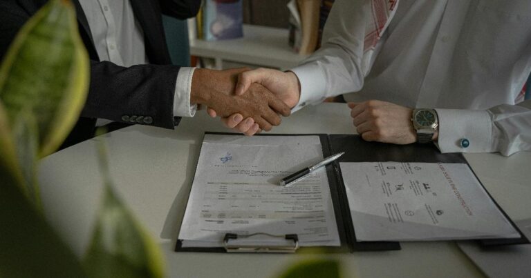 Two founders reviewing a partnership plan that looks polished but may hide a weak shared problem, illustrating partnership validation mistakes
