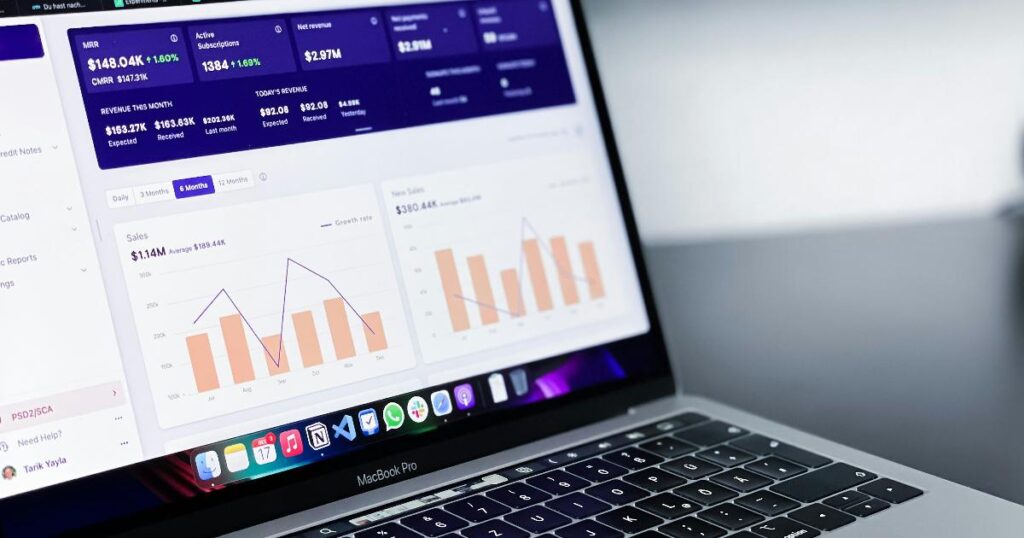 A business dashboard with live metrics and a laptop showing notes on validation, illustrating the fast data validation mistake