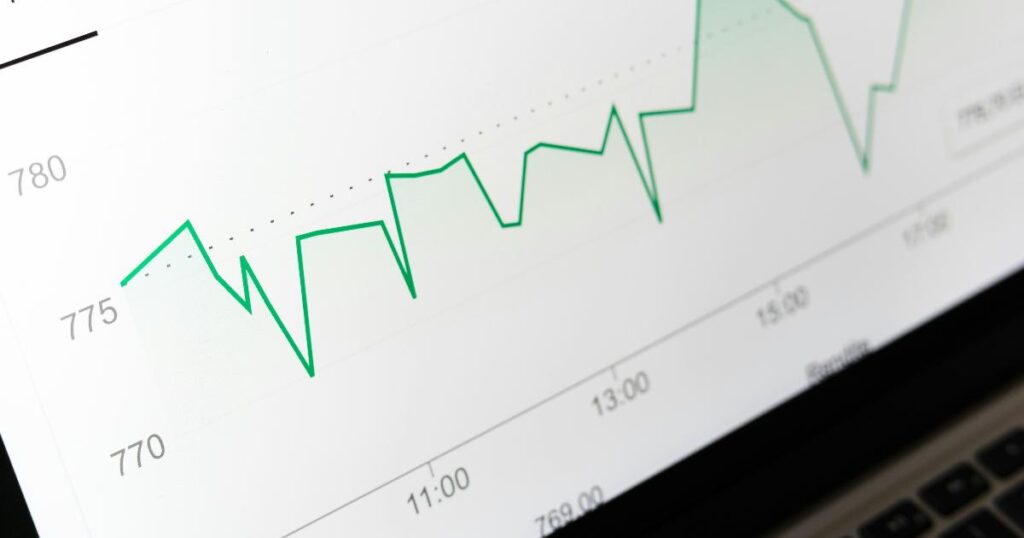 A researcher reviews pricing charts and customer notes to judge whether a pricing experiment reveals real demand or hidden confusion