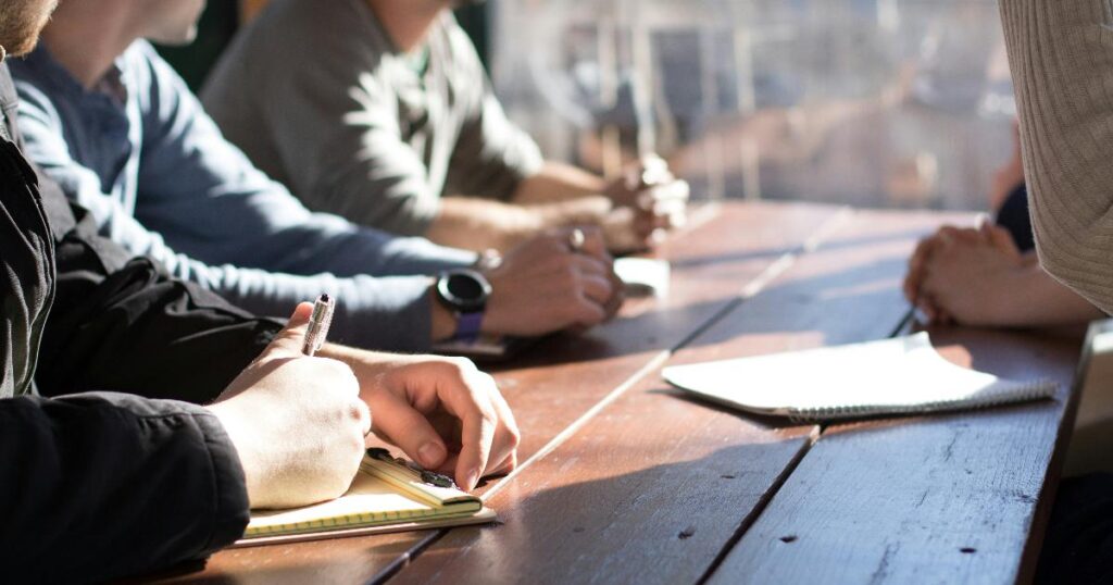 A product team discussing test results and debating the best next step in a meeting room