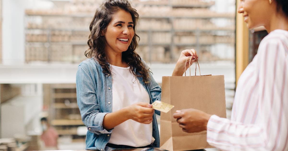 A store launch learning loop with shoppers entering a small retail shop and staff observing customer behavior